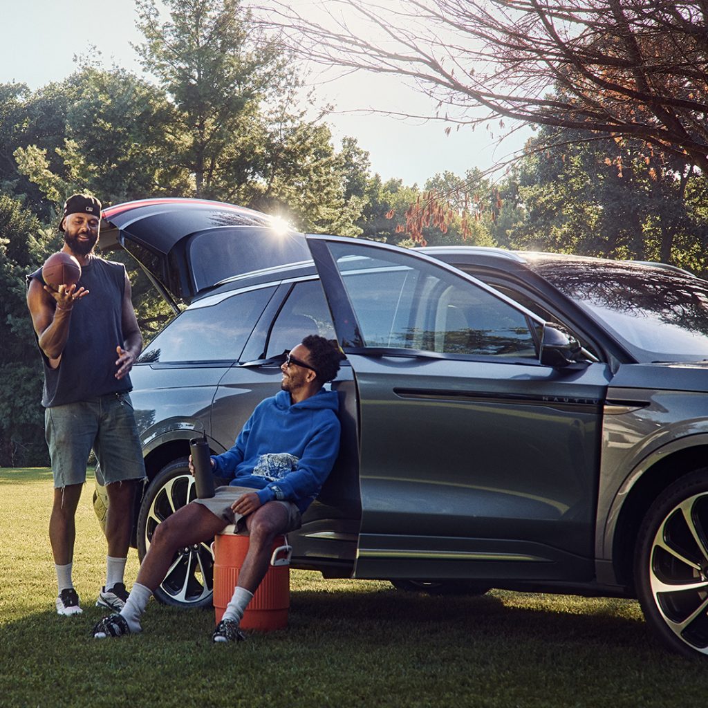 Lincoln vehicle social media post with people doing outdoor activities