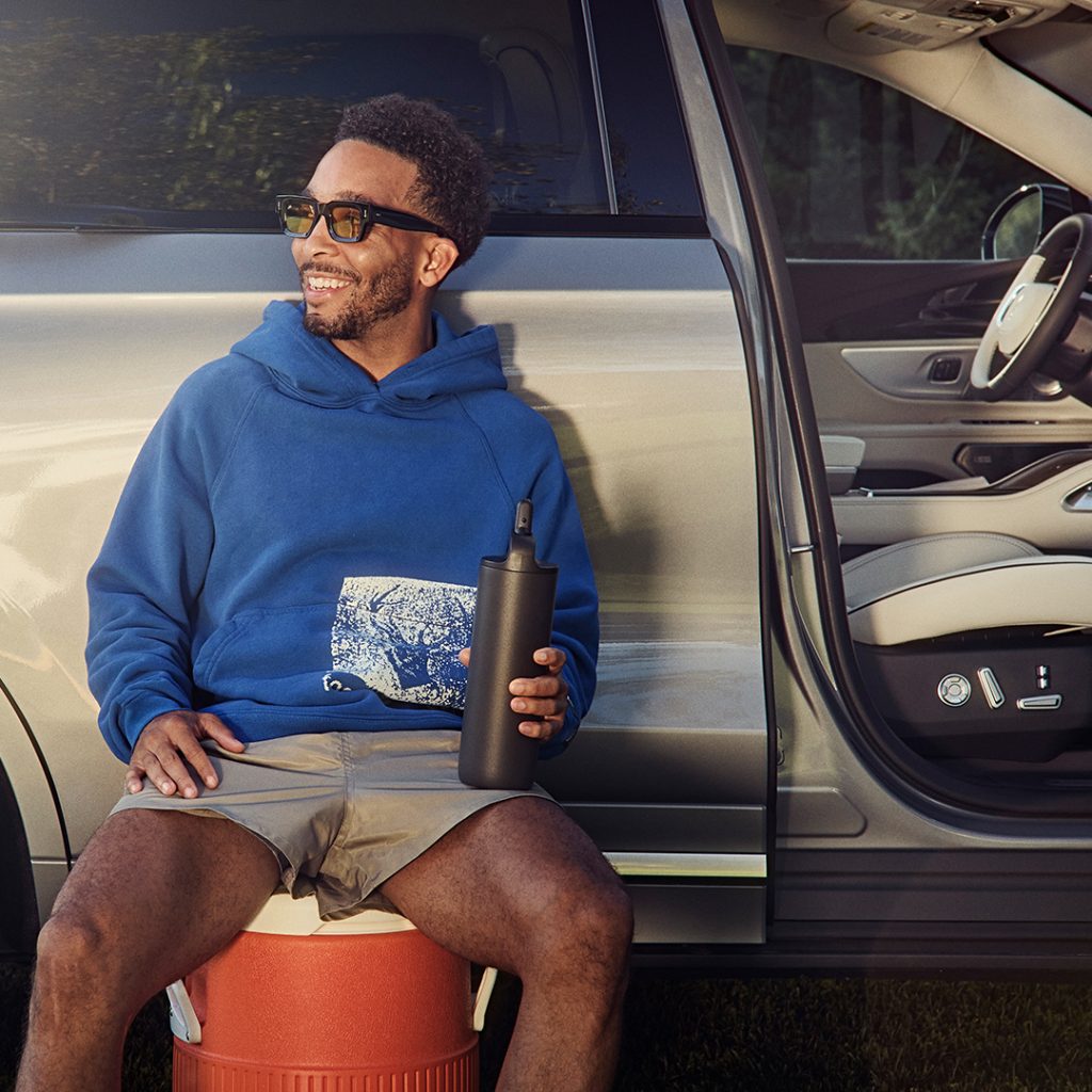 Lincoln owner driving the luxury vehicle to outdoor