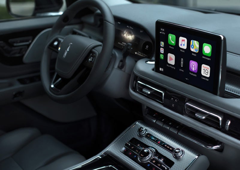 The center console touchscreen of a 2022 Lincoln Aviator® SUV is shown displaying a number of smartphone compatible capabilities