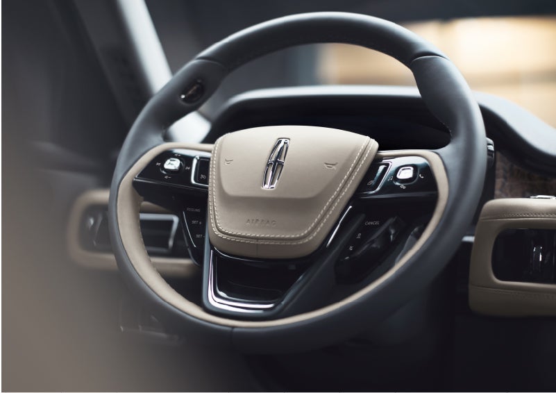The intuitively placed controls of the steering wheel on a 2023 Lincoln Aviator® SUV | Stevens Creek Lincoln in San Jose CA