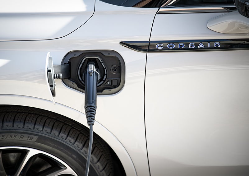 A 2023 Lincoln Corsair® Grand Touring model is shown being charged via the driver’s side charging port. | Stevens Creek Lincoln in San Jose CA
