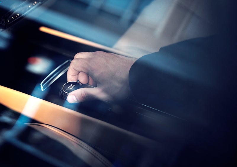 The driver of a 2023 Lincoln Corsair® SUV is shown adjusting the drive mode. | Stevens Creek Lincoln in San Jose CA