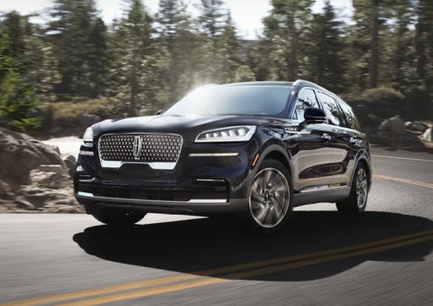 A Lincoln Aviator® SUV is being driven on a winding mountain road | Stevens Creek Lincoln in San Jose CA