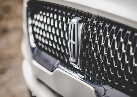 The grille of the 2024 Lincoln Aviator® Reserve model with an eye-catching repeated field of Lincoln Star logo shapes | Stevens Creek Lincoln in San Jose CA