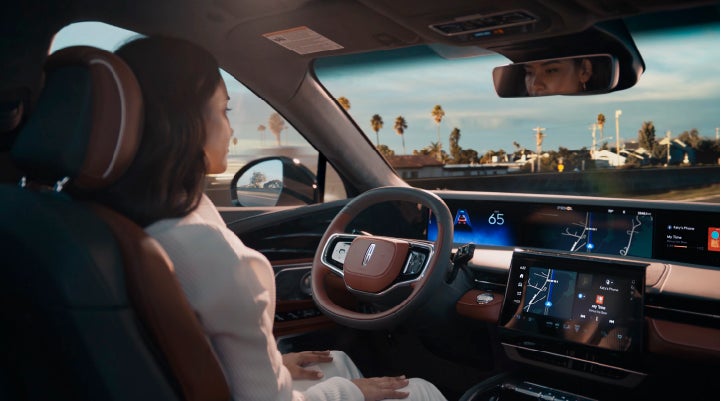 A person is shown driving hands-free on the highway with available Lincoln BlueCruise technology. | Stevens Creek Lincoln in San Jose CA