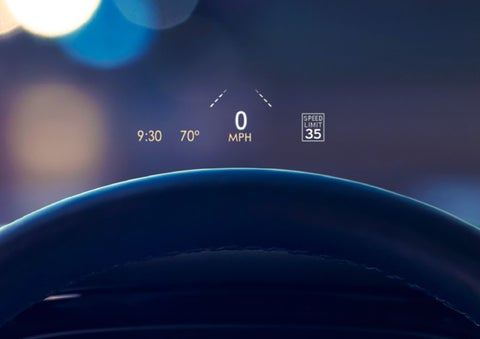 Useful driver information is being projected onto the windshield by the available Head-Up Display.
