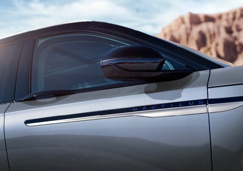 Blue lettering on the side of the vehicle that reads nautilus indicates the available hybrid powertrain. | Stevens Creek Lincoln in San Jose CA