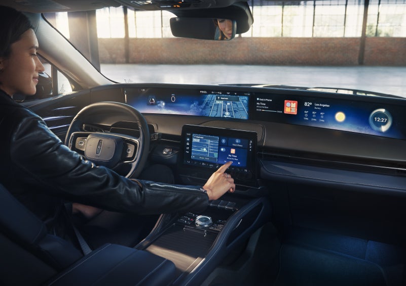 The driver of a 2026 Lincoln Nautilus® SUV interacts with the center touchscreen. | Stevens Creek Lincoln in San Jose CA