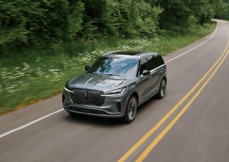 A 2027 Lincoln Aviator® SUV is being driven down a road. | Stevens Creek Lincoln in San Jose CA