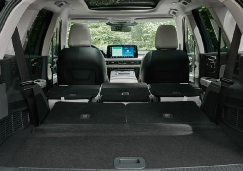 A rear to front view of the interior of a 2027 Lincoln Aviator® Black Label™ SUV shows the third and second rows folded flat | Stevens Creek Lincoln in San Jose CA